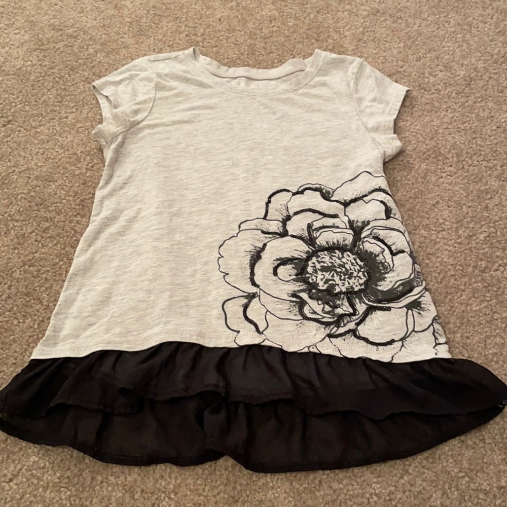 Dressy tee shirt with flow design and trim!
